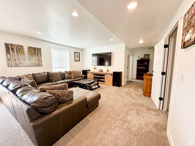 1384 E Abigail Ln, Eagle Mountain, UT 84005 - living room featuring light carpet, a textured ceiling, recessed lighting, and baseboards