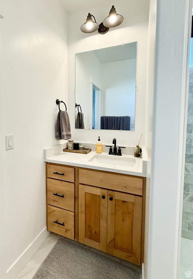 1384 E Abigail Ln, Eagle Mountain, UT 84005 - bathroom with marble look tile flooring, vanity, and baseboards