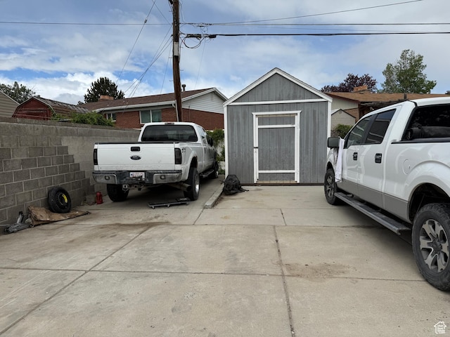 4380 S Perigrine Way, West Valley City, UT 84120 - garage featuring a storage unit