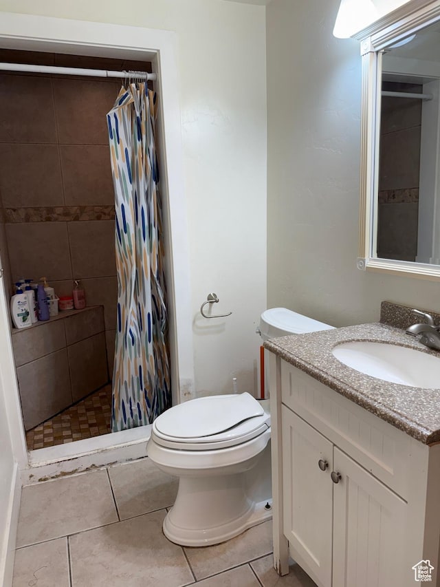 4380 S Perigrine Way, West Valley City, UT 84120 - bathroom with vanity, a shower stall, toilet, and tile patterned flooring