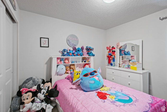2503 N Velvet Moon Dr W Unit 636, Saratoga Springs, UT 84045 - bedroom featuring a textured ceiling and a closet