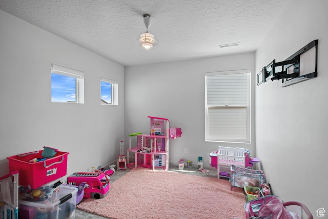 2503 N Velvet Moon Dr W Unit 636, Saratoga Springs, UT 84045 - playroom with carpet flooring and a textured ceiling