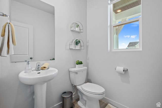 2503 N Velvet Moon Dr W Unit 636, Saratoga Springs, UT 84045 - bathroom with toilet, baseboards, wood finished floors, and a sink