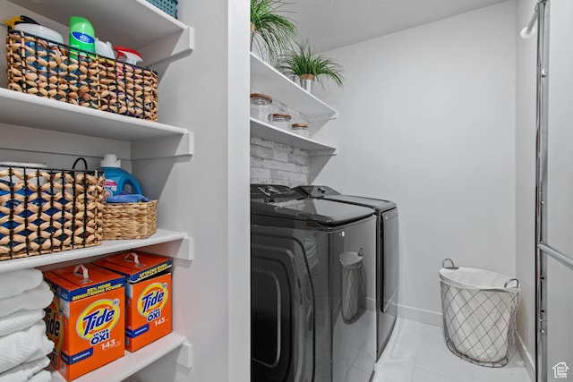 2503 N Velvet Moon Dr W Unit 636, Saratoga Springs, UT 84045 - laundry room featuring washer and dryer and baseboards