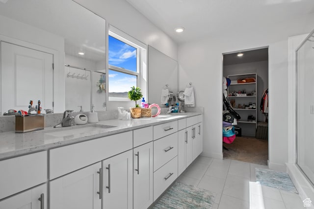 2503 N Velvet Moon Dr W Unit 636, Saratoga Springs, UT 84045 - full bath with a stall shower, double vanity, a walk in closet, recessed lighting, and tile patterned floors