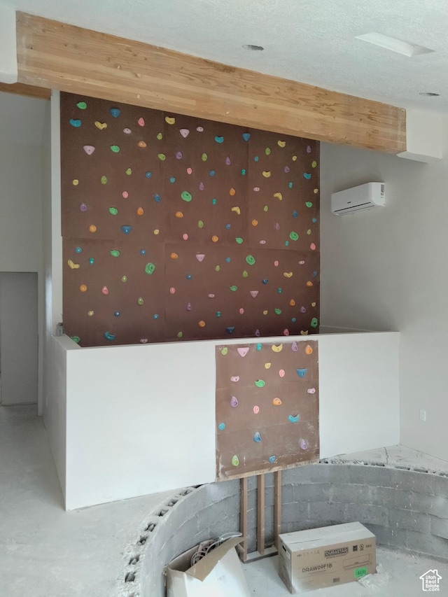 10960 N Anderson Way, Tremonton, UT 84337 - spare room with concrete floors and a wall mounted air conditioner