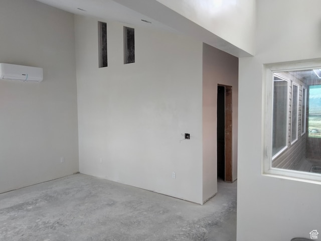 10960 N Anderson Way, Tremonton, UT 84337 - spare room with concrete floors and a wall mounted air conditioner