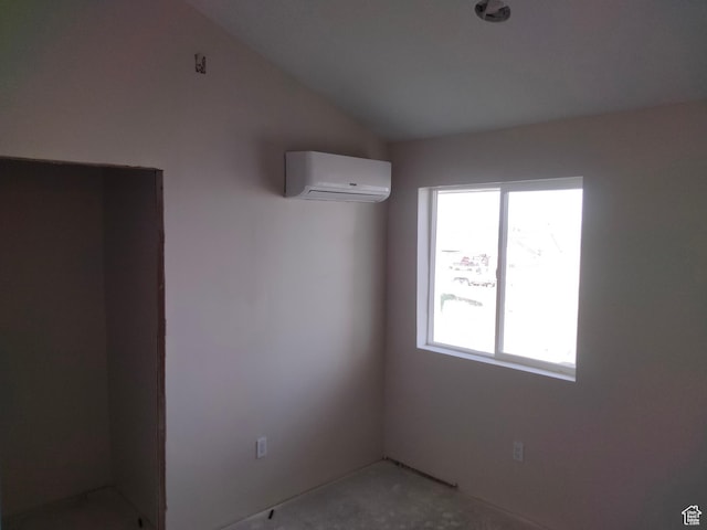 10960 N Anderson Way, Tremonton, UT 84337 - empty room with an AC wall unit and lofted ceiling