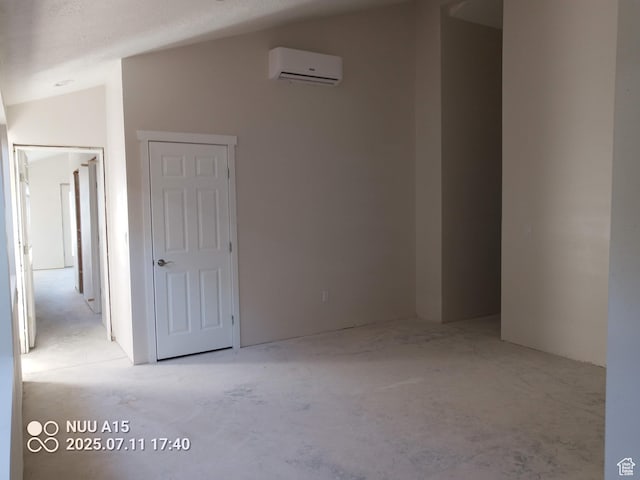 10960 N Anderson Way, Tremonton, UT 84337 - unfurnished room featuring a wall unit AC and lofted ceiling