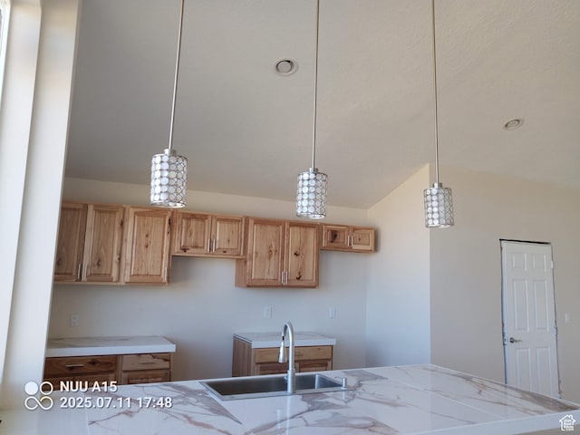 10960 N Anderson Way, Tremonton, UT 84337 - kitchen featuring lofted ceiling, light stone counters, hanging light fixtures, and light brown cabinets