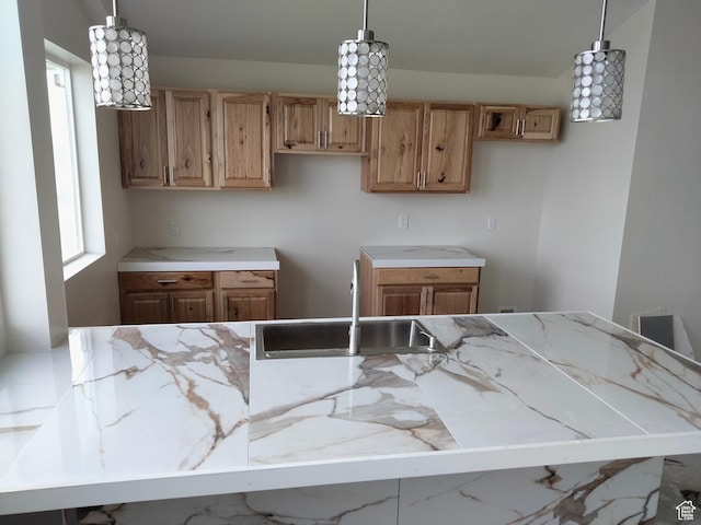 10960 N Anderson Way, Tremonton, UT 84337 - kitchen with a sink, light stone countertops, and decorative light fixtures