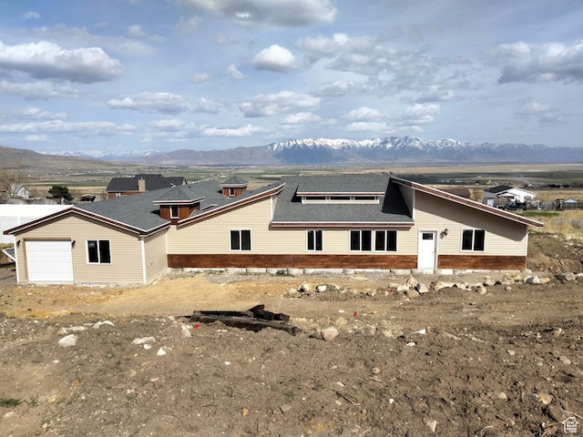 10960 N Anderson Way, Tremonton, UT 84337 - view of side of property with a mountain view and a shingled roof
