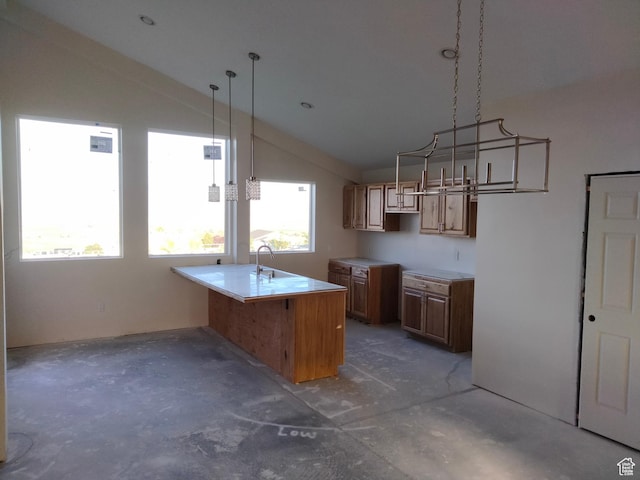 10960 N Anderson Way, Tremonton, UT 84337 - kitchen with lofted ceiling, concrete flooring, a sink, brown cabinets, and light countertops