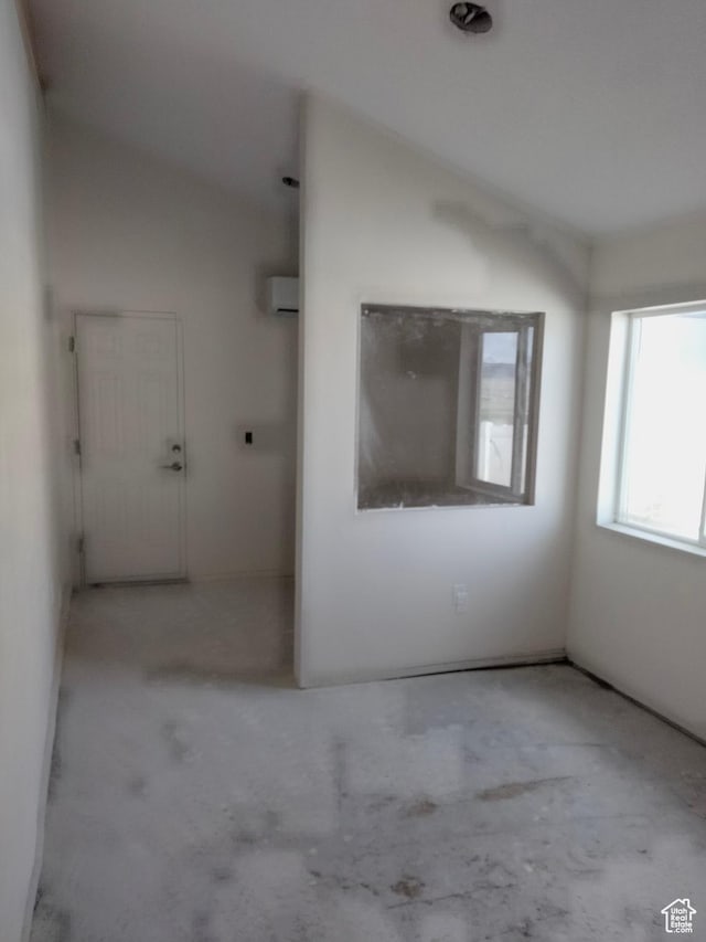 10960 N Anderson Way, Tremonton, UT 84337 - unfurnished room featuring a wall unit AC and unfinished concrete floors