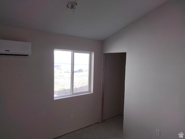10960 N Anderson Way, Tremonton, UT 84337 - unfurnished room with a wall unit AC and vaulted ceiling