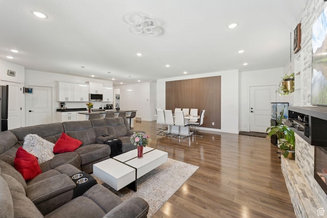 3473 N Delta St, Eagle Mountain, UT 84005 - living area featuring recessed lighting, wood finished floors, and baseboards