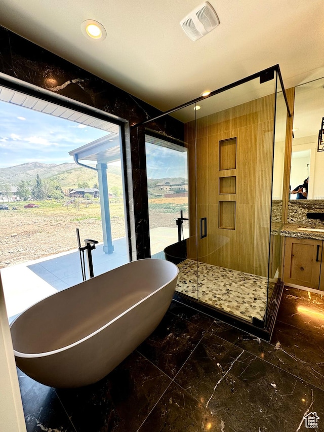 3248 E 5225 N Unit 5, Liberty, UT 84310 - full bath featuring marble finish flooring, a freestanding tub, vanity, a mountain view, and a stall shower