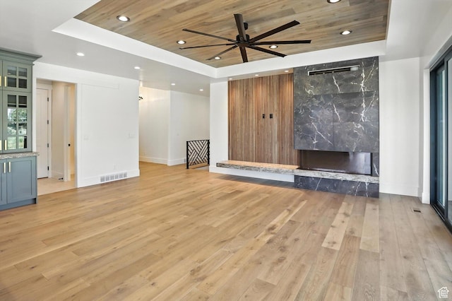 3248 E 5225 N Unit 5, Liberty, UT 84310 - unfurnished living room featuring a raised ceiling, wood ceiling, light wood-type flooring, recessed lighting, and a premium fireplace