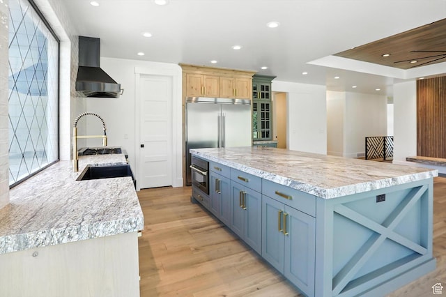 3248 E 5225 N Unit 5, Liberty, UT 84310 - kitchen with wall chimney exhaust hood, light wood-type flooring, recessed lighting, glass insert cabinets, and stainless steel appliances
