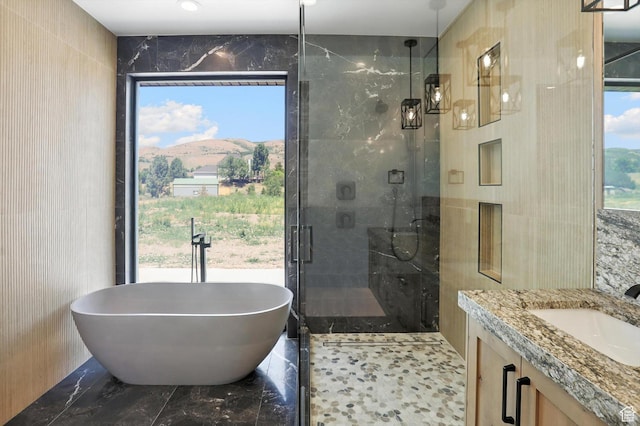 3248 E 5225 N Unit 5, Liberty, UT 84310 - bathroom with tile walls, a freestanding tub, a shower stall, vanity, and marble finish flooring