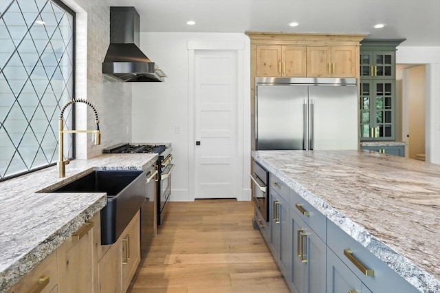 3248 E 5225 N Unit 5, Liberty, UT 84310 - kitchen featuring wall chimney exhaust hood, premium appliances, recessed lighting, light wood finished floors, and light stone counters