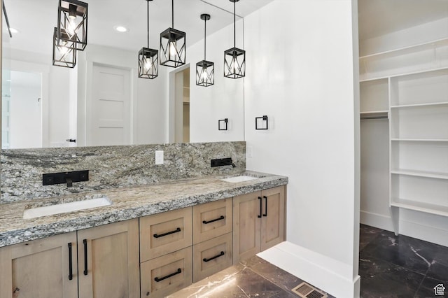3248 E 5225 N Unit 5, Liberty, UT 84310 - bathroom featuring double vanity, marble look tile flooring, recessed lighting, and a walk in closet