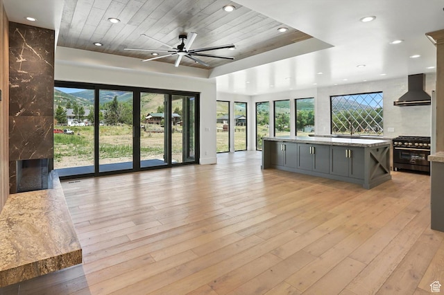 3248 E 5225 N Unit 5, Liberty, UT 84310 - unfurnished living room with a fireplace, recessed lighting, plenty of natural light, wooden ceiling, and a ceiling fan