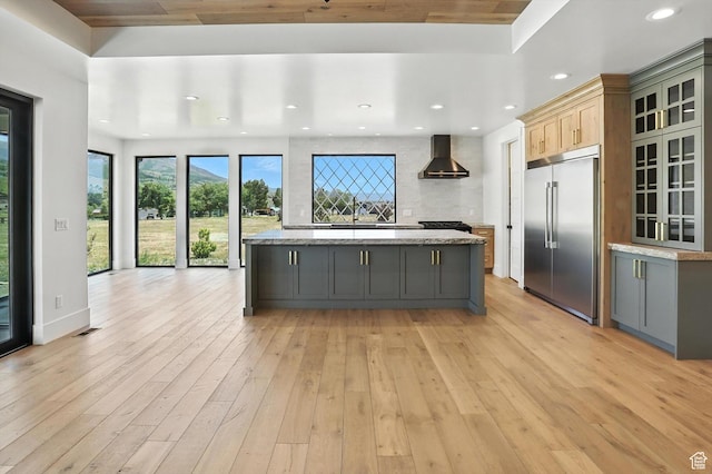 3248 E 5225 N Unit 5, Liberty, UT 84310 - kitchen featuring stainless steel built in refrigerator, wall chimney range hood, gray cabinetry, light wood-style floors, and recessed lighting