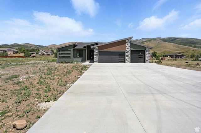 3248 E 5225 N Unit 5, Liberty, UT 84310 - contemporary home featuring a mountain view, a garage, driveway, and stone siding