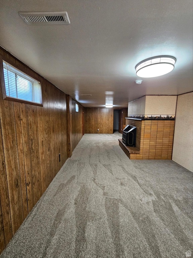 354 S 1100 E, Springville, UT 84663 - below grade area featuring wood walls, carpet floors, and a wood stove