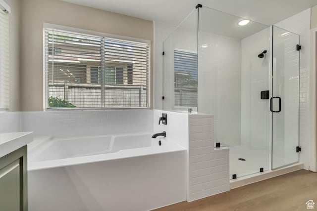 2825 Elk Horn Ln, Cottonwood Heights, UT 84093 - full bathroom with a bath, a shower stall, vanity, wood finished floors, and recessed lighting