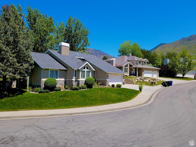 2825 Elk Horn Ln, Cottonwood Heights, UT 84093 - craftsman-style home featuring a mountain view, a garage, stone siding, and a front yard