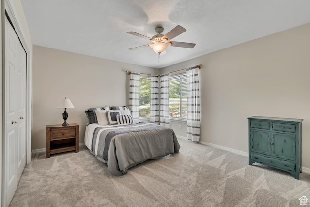 2825 Elk Horn Ln, Cottonwood Heights, UT 84093 - bedroom with light colored carpet, baseboards, a ceiling fan, and a closet