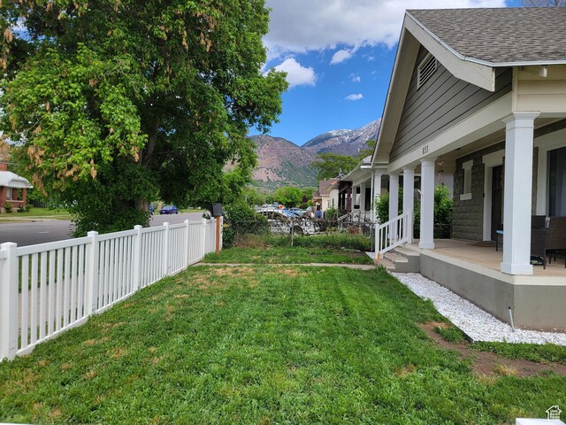 853 E 27th St, Ogden, UT 84403 - view of yard featuring a mountain view and covered porch