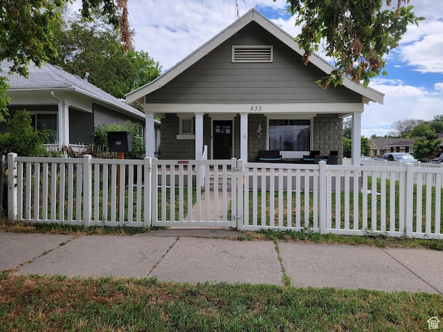853 E 27th St, Ogden, UT 84403 - view of front of house featuring a porch and a fenced front yard