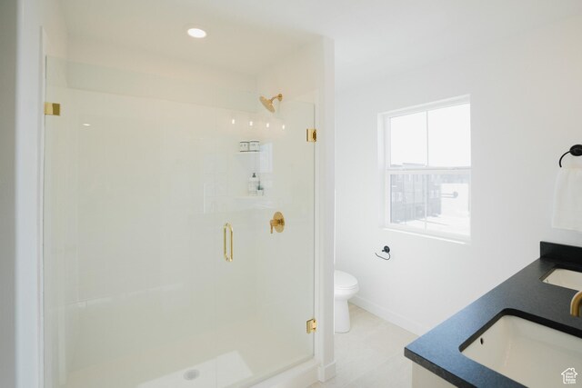 589 W 1810 N Unit 66, Salem, UT 84653 - bathroom with a stall shower, toilet, double vanity, baseboards, and recessed lighting