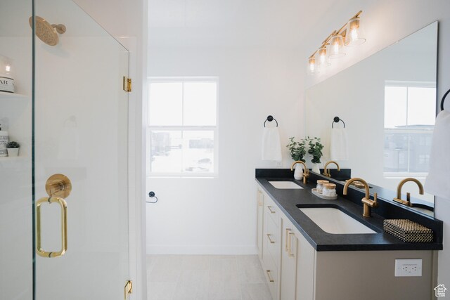 589 W 1810 N Unit 66, Salem, UT 84653 - bathroom featuring double vanity, a stall shower, and baseboards