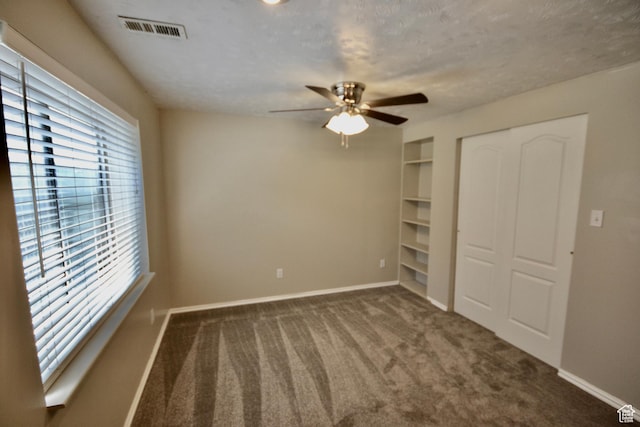 5057 W 6960 S, West Jordan, UT 84081 - unfurnished bedroom featuring baseboards, a closet, carpet, a ceiling fan, and a textured ceiling