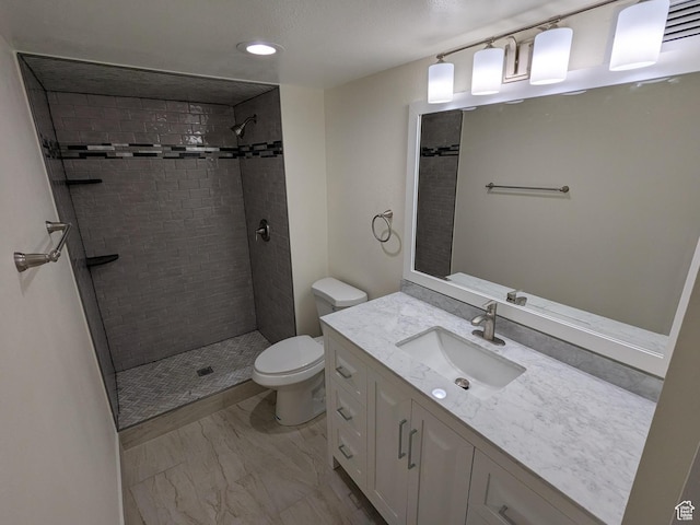 241 N Vine St W Unit 404E, Salt Lake City, UT 84103 - full bath with toilet, tiled shower, vanity, marble look tiles, and recessed lighting