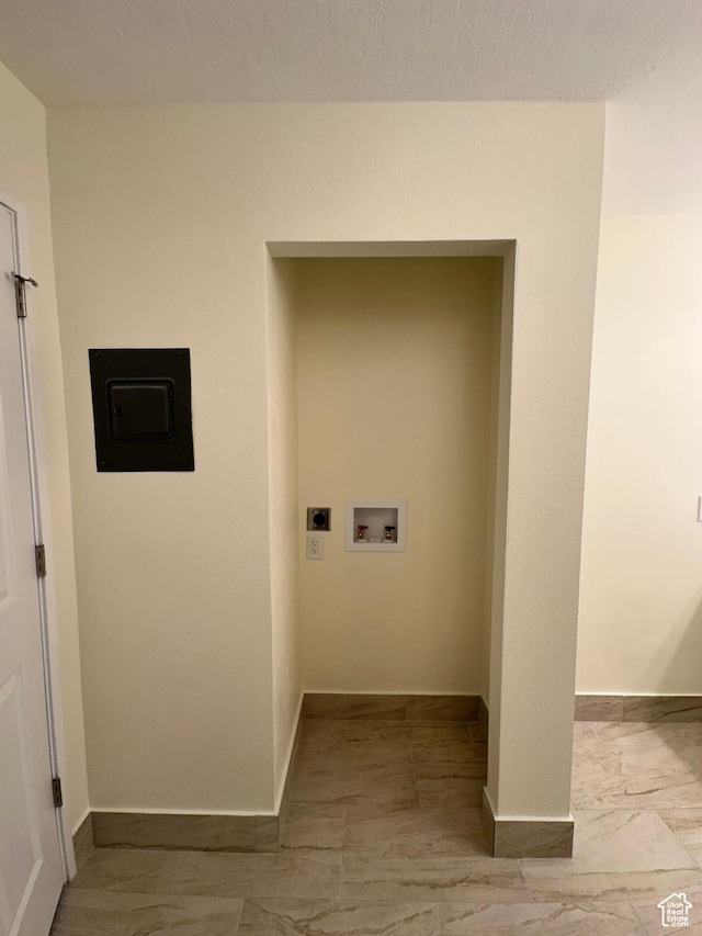 241 N Vine St W Unit 404E, Salt Lake City, UT 84103 - washroom with electric dryer hookup, marble finish flooring, hookup for a washing machine, and baseboards