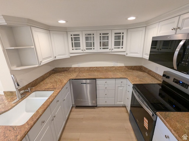 241 N Vine St W Unit 404E, Salt Lake City, UT 84103 - kitchen with stainless steel appliances, a sink, white cabinets, and recessed lighting