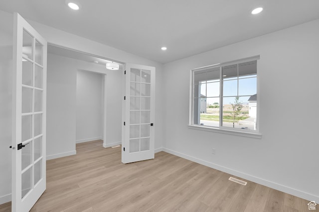 1089 S 3170 E Unit 205, Spanish Fork, UT 84660 - spare room featuring french doors, light wood finished floors, and recessed lighting
