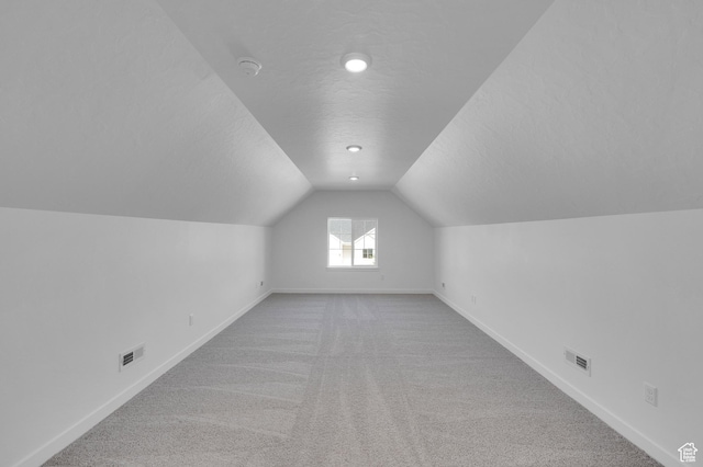 1089 S 3170 E Unit 205, Spanish Fork, UT 84660 - bonus room with a textured ceiling, carpet flooring, and lofted ceiling