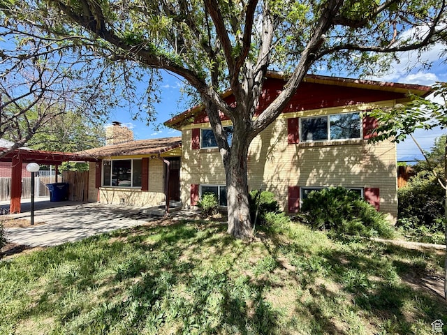 4203 S 4900 W, West Valley City, UT 84120 - tri-level home featuring a chimney and brick siding