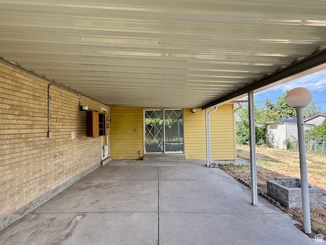 4203 S 4900 W, West Valley City, UT 84120 - view of patio / terrace featuring an attached carport