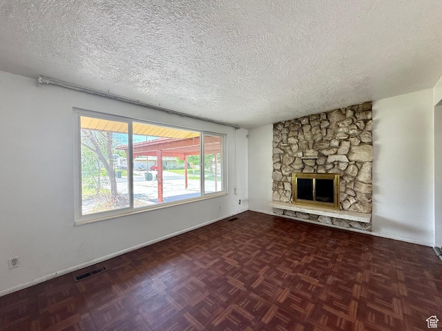 4203 S 4900 W, West Valley City, UT 84120 - unfurnished living room with a textured ceiling, a fireplace, and baseboards