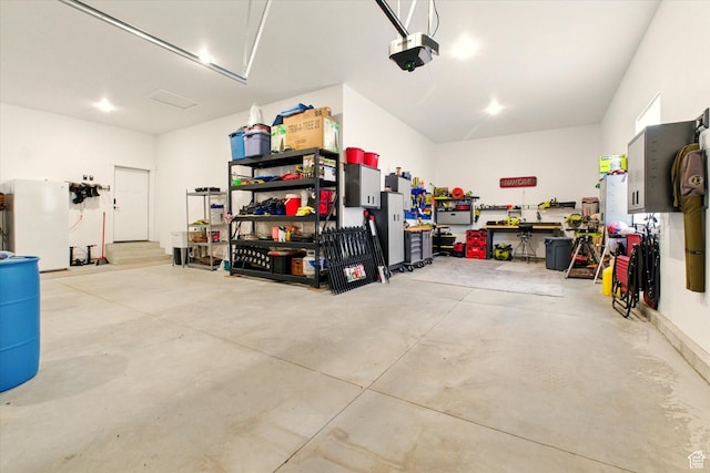 653 S 1140 E, Smithfield, UT 84335 - garage with a garage door opener and a workshop area