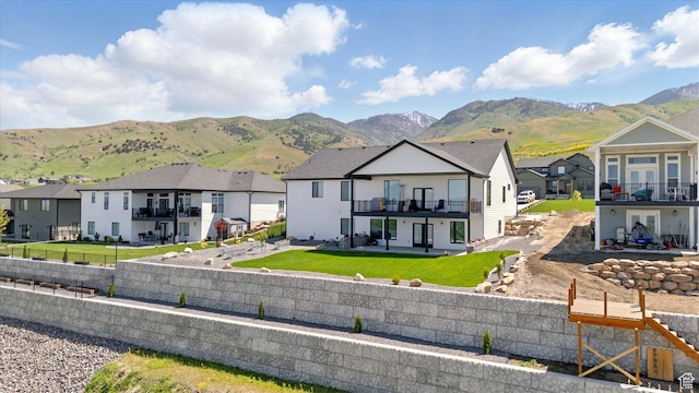 653 S 1140 E, Smithfield, UT 84335 - back of property featuring a residential view, a patio, a mountain view, and a balcony