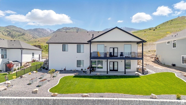 653 S 1140 E, Smithfield, UT 84335 - back of house with a patio area, a mountain view, a balcony, and a garden