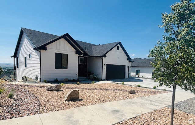 653 S 1140 E, Smithfield, UT 84335 - modern farmhouse with a shingled roof, a garage, board and batten siding, and concrete driveway